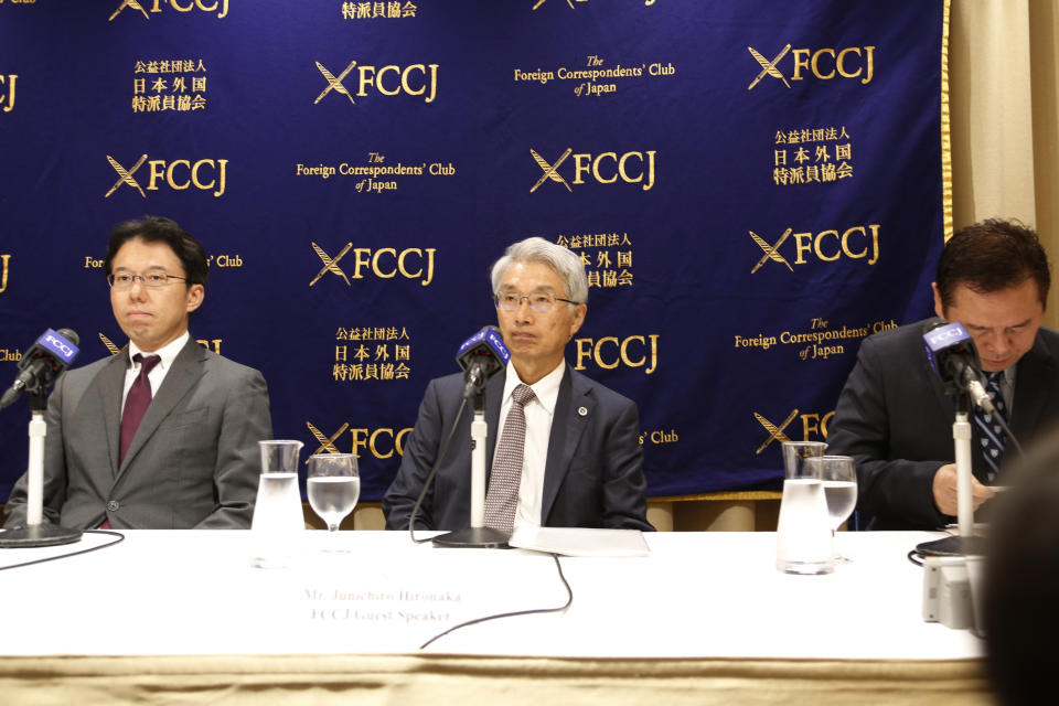 Hiroshi Kawatsu, left, and Junichiro Hironaka, center, lawyers for Nissan’s former Chairman Carlos Ghosn, attends a press conference in Tokyo Monday, Nov. 11, 2019. The lawyers of Ghosn, awaiting trial on various financial misconduct charges, are saying they have not seen any evidence, including official company records, that backs any of the prosecutors’ allegations, a year after the arrest. (AP Photo/Yuri Kageyama)