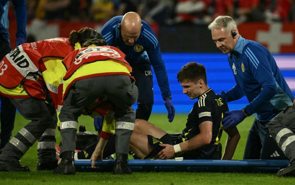 Kieran Tierney is placed on a stretcher ahead of departing Scotland's draw with Switzerland/Kieran Tierney injury risks scuppering summer transfer away from Arsenal