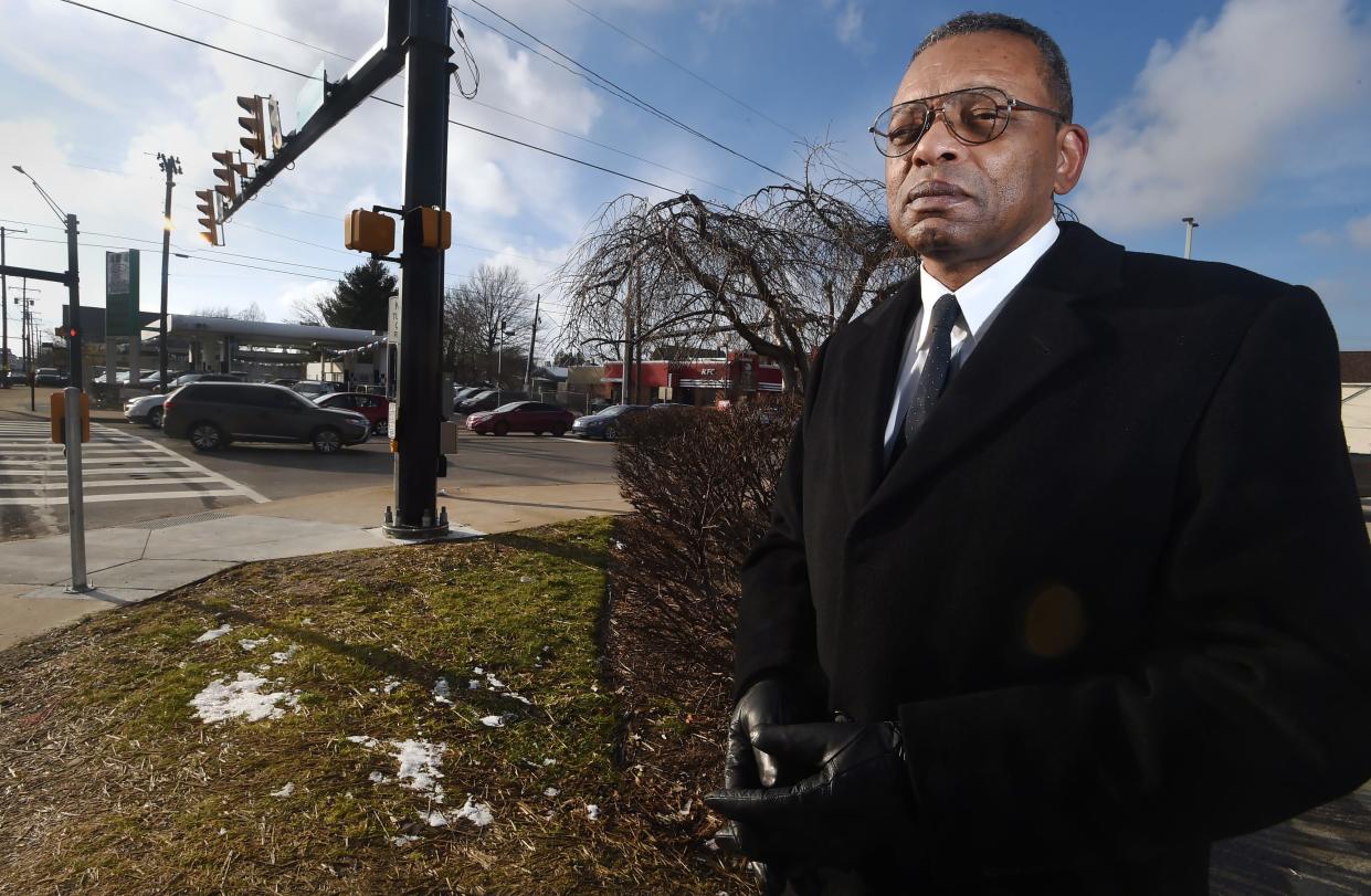 Kevin Johnson, 61, stands on the northeast corner of East 12th and Parade streets, where a state historical marker will commemorate the site of Erie's earliest known Underground Railroad station. The marker is planned for the grassy patch at left. Johnson led research finding the 45-acre property of Emma Howell and her husband James Ford, with a tavern and boarding house near their home, operated the station from about 1811 to 1836.