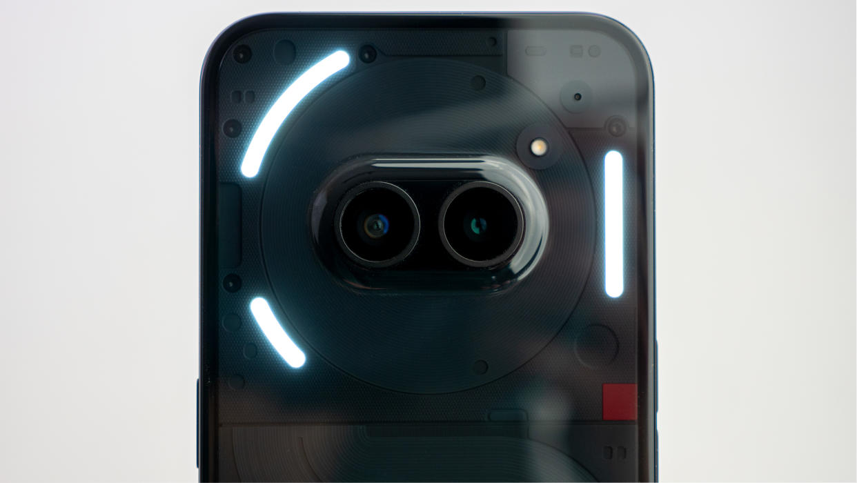  The camera island on the back of the Nothing Phone (2a) with the glyph lights illuminated. 