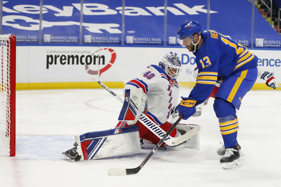 Buffalo Sabres forward Tobias Rieder (13) puts the puck past New York Rangers goalie Alexandar Georgiev (40) during the second period of an NHL hockey game, Tuesday, Jan. 26, 2021, in Buffalo, N.Y. (AP Photo/Jeffrey T. Barnes)