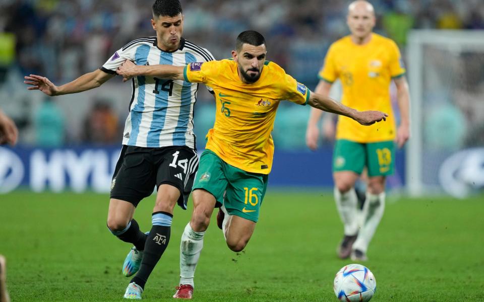 Australia's Aziz Behich, right, and Argentina's Exequiel Palacios battle for the ball during the World Cup round of 16 soccer match between Argentina and Australia at the Ahmad Bin Ali Stadium in Doha - AP