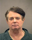 <p>In this handout provided by Alexandria Sheriff’s Office, Paul Manafort poses for a mugshot photo at the Alexandria Detention Center in Alexandria, Va. Manafort has been charged with money laundering and bank fraud, among other violations. (Photo: Alexandria Sheriff’s Office via Getty Images) </p>