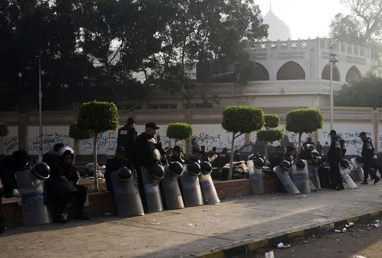 Egyptian riot policemen deploy outside the presidential palace in Cairo on February 2, 2013. The National Salvation Front said it "completely sides with the people and its active forces' calls to topple the authoritarian regime and the Muslim Brotherhood's control."