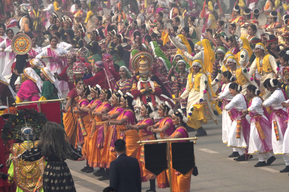 School children present a dance on the ceremonial street Kartavyapath boulevard during India's Republic Day parade celebrations in New Delhi, India, Friday, Jan. 26, 2024. (AP Photo/Manish Swarup)