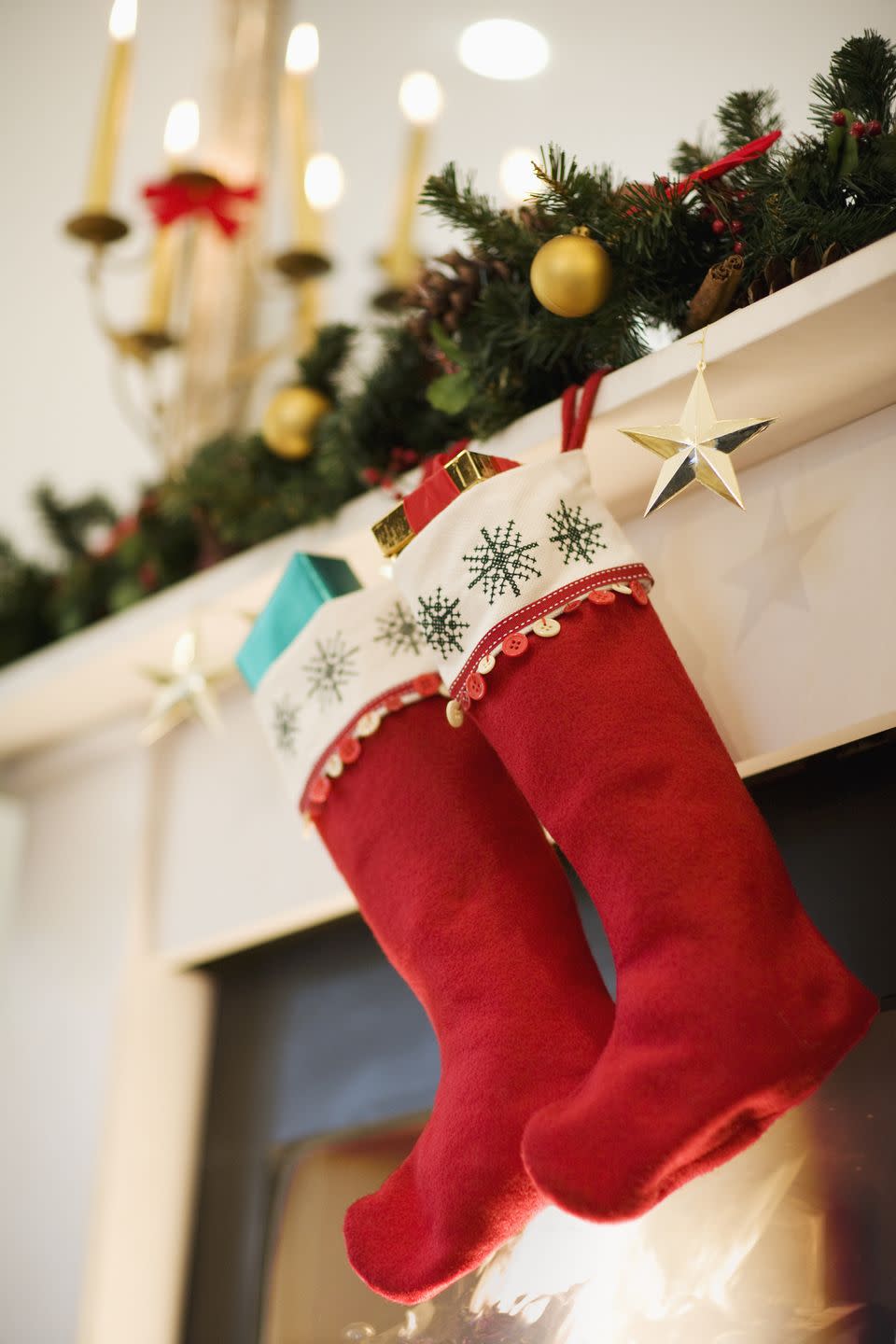 <p>Hanging stockings takes all of five minutes, so why not extend the fun by crafting your own? You don't need any knitting skills. For an easy activity even your preschoolers can do, buy simple stockings and supplies like glitter puff paint, then let everyone get to work personalizing their own. </p><p><a class="link " href="https://www.amazon.com/Meriwoods-Christmas-Stockings-Personalized-Decorations/dp/B08F2C3HWZ?tag=syn-yahoo-20&ascsubtag=%5Bartid%7C10072.g.34454588%5Bsrc%7Cyahoo-us" rel="nofollow noopener" target="_blank" data-ylk="slk:SHOP STOCKINGS;elm:context_link;itc:0;sec:content-canvas">SHOP STOCKINGS</a></p>