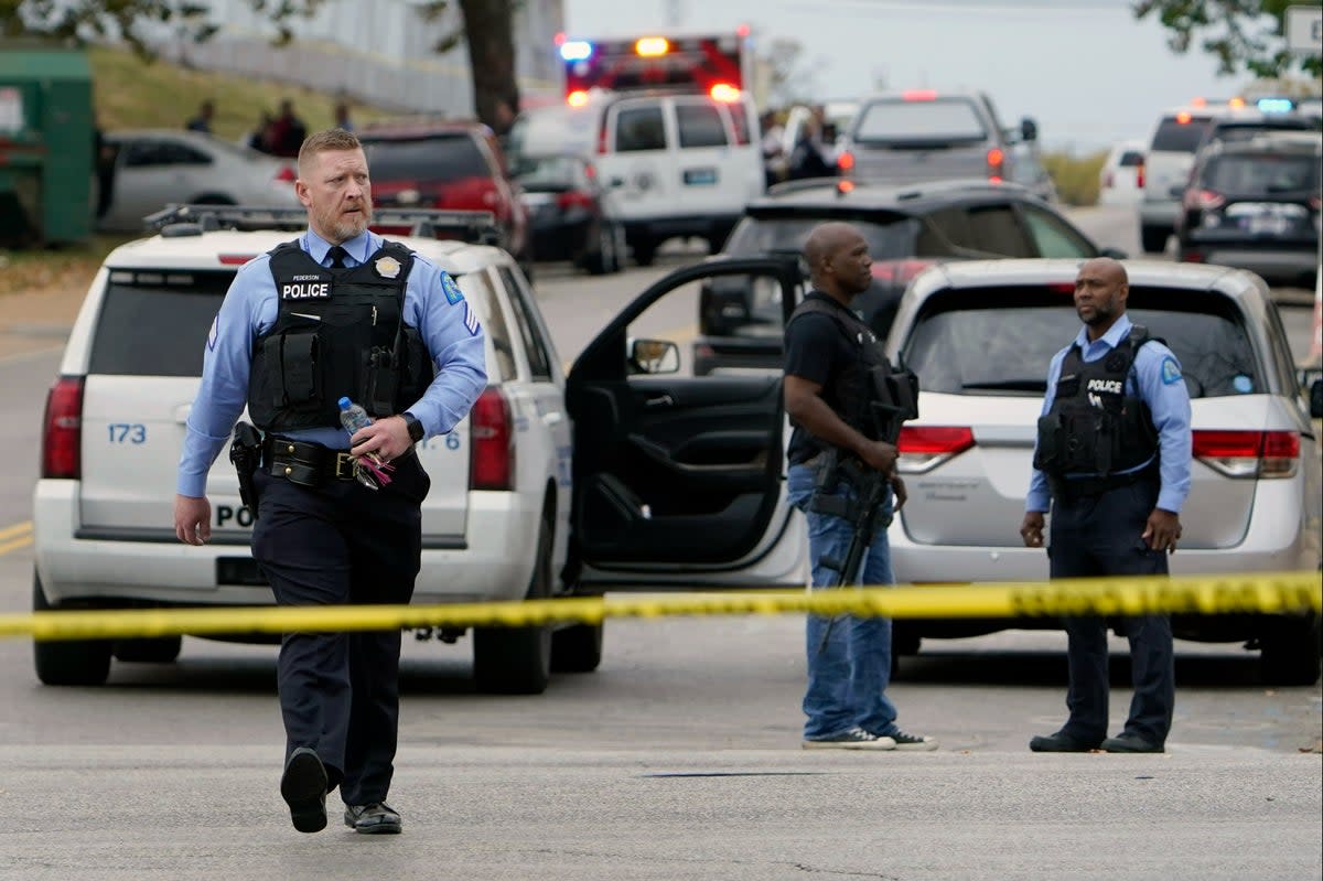 Police at the scene on Monday  (AP)