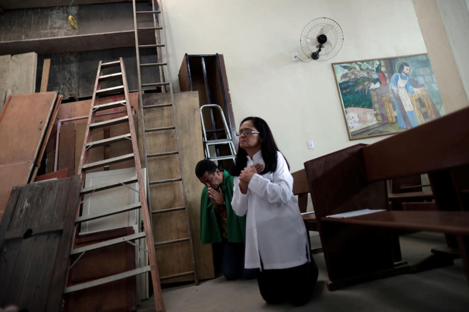 <p>Luis Claudio, who has lived in the Vila Autodromo slum for 23 years, attends a mass at a Catholic church, the only original building that will not be demolished in the community, in Rio de Janeiro, Brazil, July 31, 2016. Picture taken July 31, 2016. (REUTERS/Ricardo Moraes)</p>