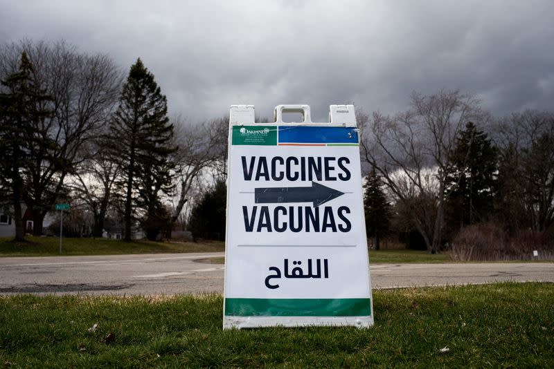 FILE PHOTO: People receive their second COVID-19 boosters in Waterford, Michigan