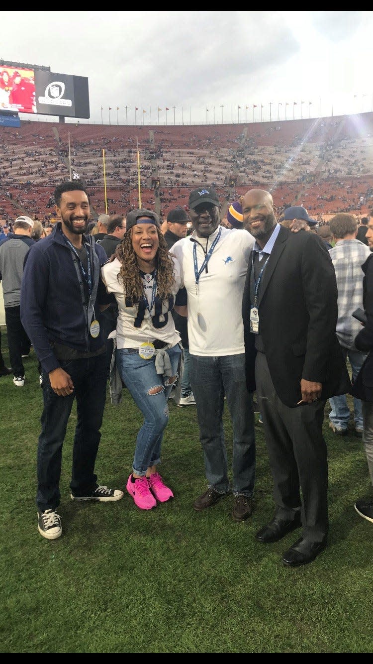 From right, Brad Holmes, Luther Bradley, Bradley's daughter, Lutasha, and Bradley's son, Daniel, attend an NFL playoff game in Los Angeles.