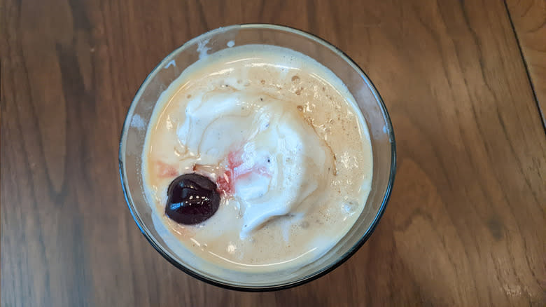 Cherry floating in Starbucks Hot Honey Affogato