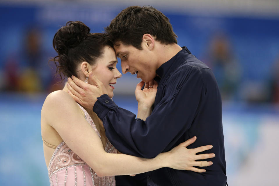 Tessa Virtue and Scott Moir of Canada compete in the ice dance free dance figure skating finals at the Iceberg Skating Palace during the 2014 Winter Olympics, Monday, Feb. 17, 2014, in Sochi, Russia. (AP Photo/Darron Cummings)