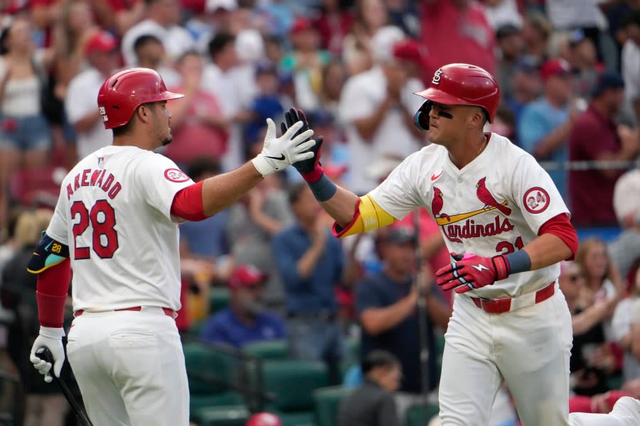 St. Louis Cardinals’ <a class="link " href="https://sports.yahoo.com/mlb/players/12212/" data-i13n="sec:content-canvas;subsec:anchor_text;elm:context_link" data-ylk="slk:Lars Nootbaar;sec:content-canvas;subsec:anchor_text;elm:context_link;itc:0">Lars Nootbaar</a> (21) is congratulated by teammate <a class="link " href="https://sports.yahoo.com/mlb/players/9105/" data-i13n="sec:content-canvas;subsec:anchor_text;elm:context_link" data-ylk="slk:Nolan Arenado;sec:content-canvas;subsec:anchor_text;elm:context_link;itc:0">Nolan Arenado</a> (28) after hitting a solo home run during the second inning in the second game of a baseball doubleheader against the Kansas City Royals Wednesday, July 10, 2024, in St. Louis. (AP Photo/Jeff Roberson)