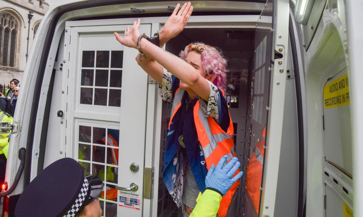<span>Police officers arresting the Just Stop Oil activist Phoebe Plummer (shown) on 19 July 2023 after a slow march along Cromwell Road, south-west London.</span><span>Photograph: Vuk Valcic/Zuma Press Wire/Shutterstock</span>