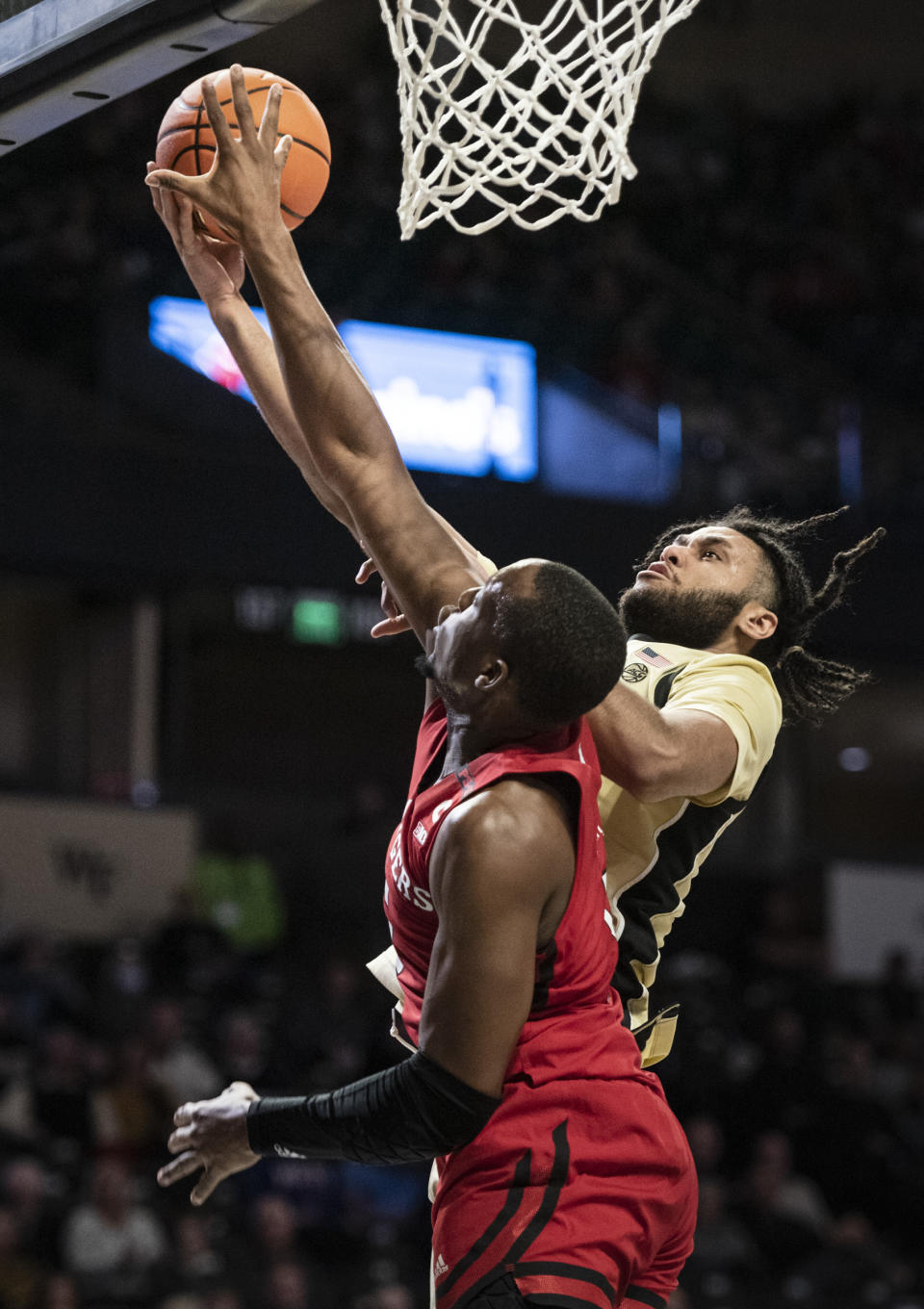 Wake Forest forward Efton Reid III (4) shoots over Rutgers' forward Aundre Hyatt (5) during the first half of an NCAA college basketball game on Wednesday, Dec. 6, 2023, at Joel Coliseum in Winston-Salem, N.C. (Allison Lee Isley/The Winston-Salem Journal via AP)