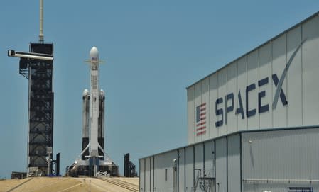 A SpaceX Falcon Heavy rocket, carrying the U.S. Air Force’s Space Test Program-2 mission, is shown during launch preparation at the Kennedy Space Center in Cape Canaveral