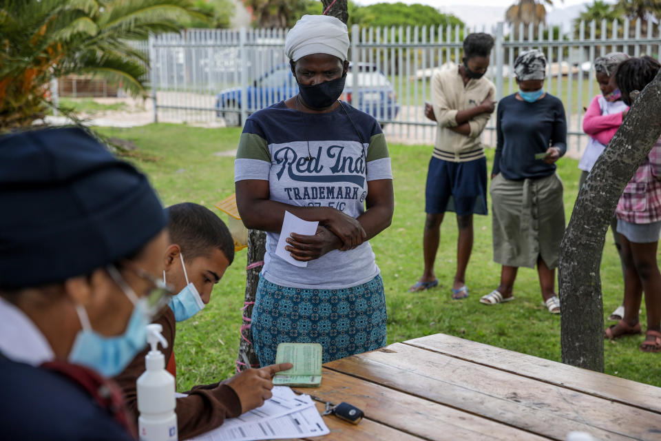 A resident registers their details at a vaccination point at Cape Flats Development Association (CAFDA) in the Egoli township of Cape Town, South Africa, on Tuesday, Nov. 30, 2021. South African scientists were last week the first to identify the new variant now known as omicron, and while symptoms have been described as mild, the exact risk from the new strain is still uncertain.<span class="copyright">Dwayne Senior—Bloomberg/Getty Images</span>