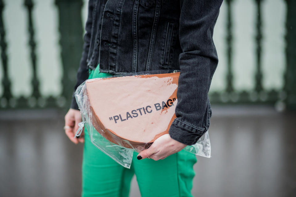 <p>Model carries an Off-White clear “Plastic Bag.” (Photo: Getty Images) </p>