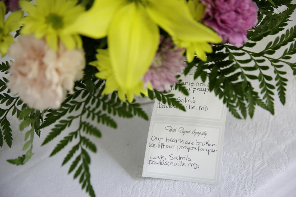Flowers sit on a table in the basement following a service at the Emanuel A.M.E. Church four days after a mass shooting that claimed the lives of its pastor and eight others on Sunday, June 21, 2015, in Charleston, S.C. The congregation at Emanuel African Methodist Episcopal swayed and sang, prayed and welcomed the world into their sanctuary on Sunday, holding the first worship service since a white gunman was accused of opening fire during a Bible study group, killing nine black church members. (AP Photo/David Goldman, Pool)
