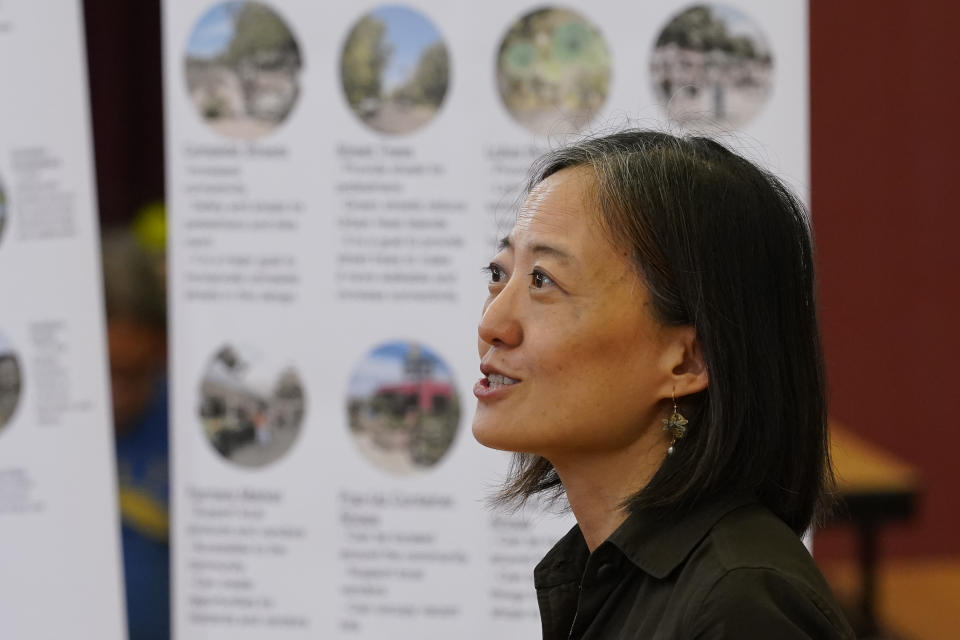 Arizona State University graduate design professor Chingwen Cheng speaks at Academia del Pueblo charter school, Friday, Sept 28, 2022, in Phoenix. Community members were learning how to organize and advocate for cooler, greener, healthier neighborhoods. (AP Photo/Matt York)