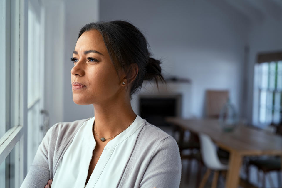 A woman looking out her window