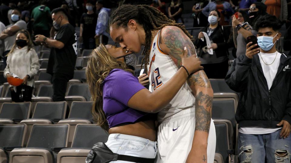 LAS VEGAS, NEVADA - OCTOBER 08: Brittney Griner #42 of the Phoenix Mercury kisses her wife Cherelle Griner in the stands after the Mercury defeated the Las Vegas Aces 87-84 in Game Five of the 2021 WNBA Playoffs semifinals to win the series at Michelob ULTRA Arena on October 8, 2021 in Las Vegas, Nevada. NOTE TO USER: User expressly acknowledges and agrees that, by downloading and or using this photograph, User is consenting to the terms and conditions of the Getty Images License Agreement. (Photo by Ethan Miller/Getty Images)