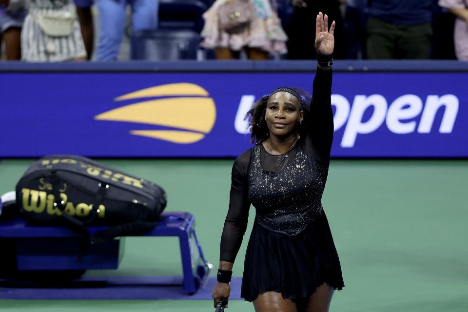 Serena Williams waves to the crowd after her round-three loss at the 2022 US Open — likely the final tournament of her career.