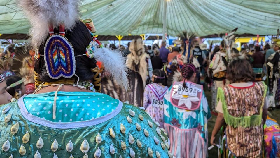 A spiraling line of dancers at the bowl in the powwow grounds during the grand entrance to the Fort a la Corne annual traditional powwow at James Smith Cree Nation on Friday, Sept. 6, 2024.