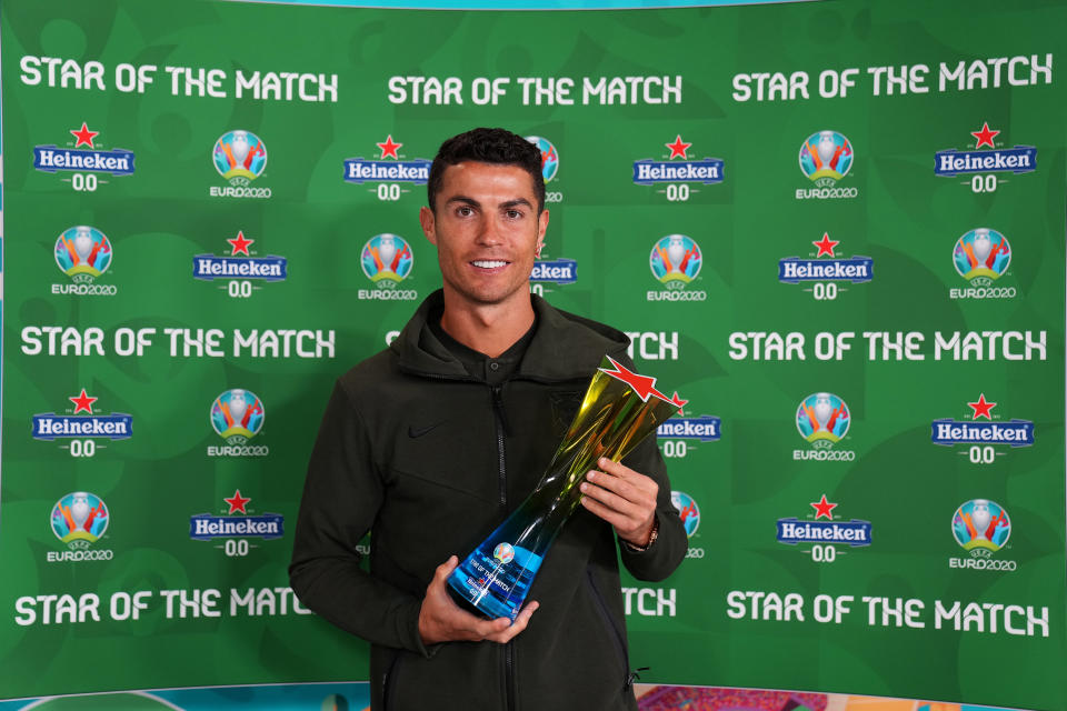 Cristiano Ronaldo (pictured) poses for a photograph with the 