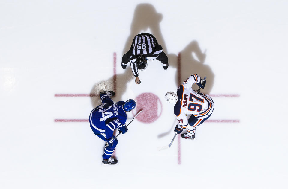 TORONTO, ON - FEBRUARY 27: Auston Matthews #34 of the Toronto Maple Leafs takes a face-off against Connor McDavid #97 of the Edmonton Oilersduring the first period at the Scotiabank Arena on February 27, 2019 in Toronto, Ontario, Canada. (Photo by Mark Blinch/NHLI via Getty Images)