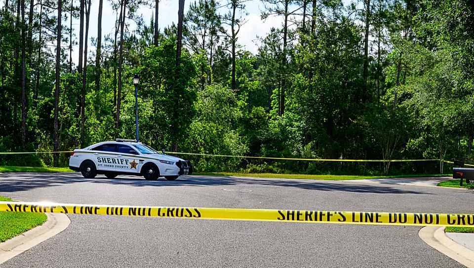 A St. Johns County Sheriff’s deputy sits in his car at the end of Saddlestone Drive in the Durbin Creek community on Monday, May 10, 2021, near where the body of Tristyn Bailey, 13, was found on Sunday. 