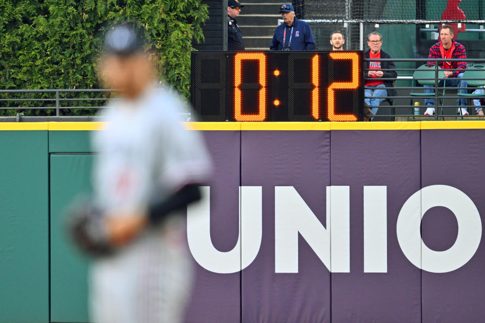 CLEVELAND, OHIO - MAY 05: The pitch clock looms behind starting pitcher Bailey Ober #17 of the Minnesota Twins during the first inning against the Cleveland Guardians at Progressive Field on May 05, 2023 in Cleveland, Ohio. (Photo by Jason Miller/Getty Images)