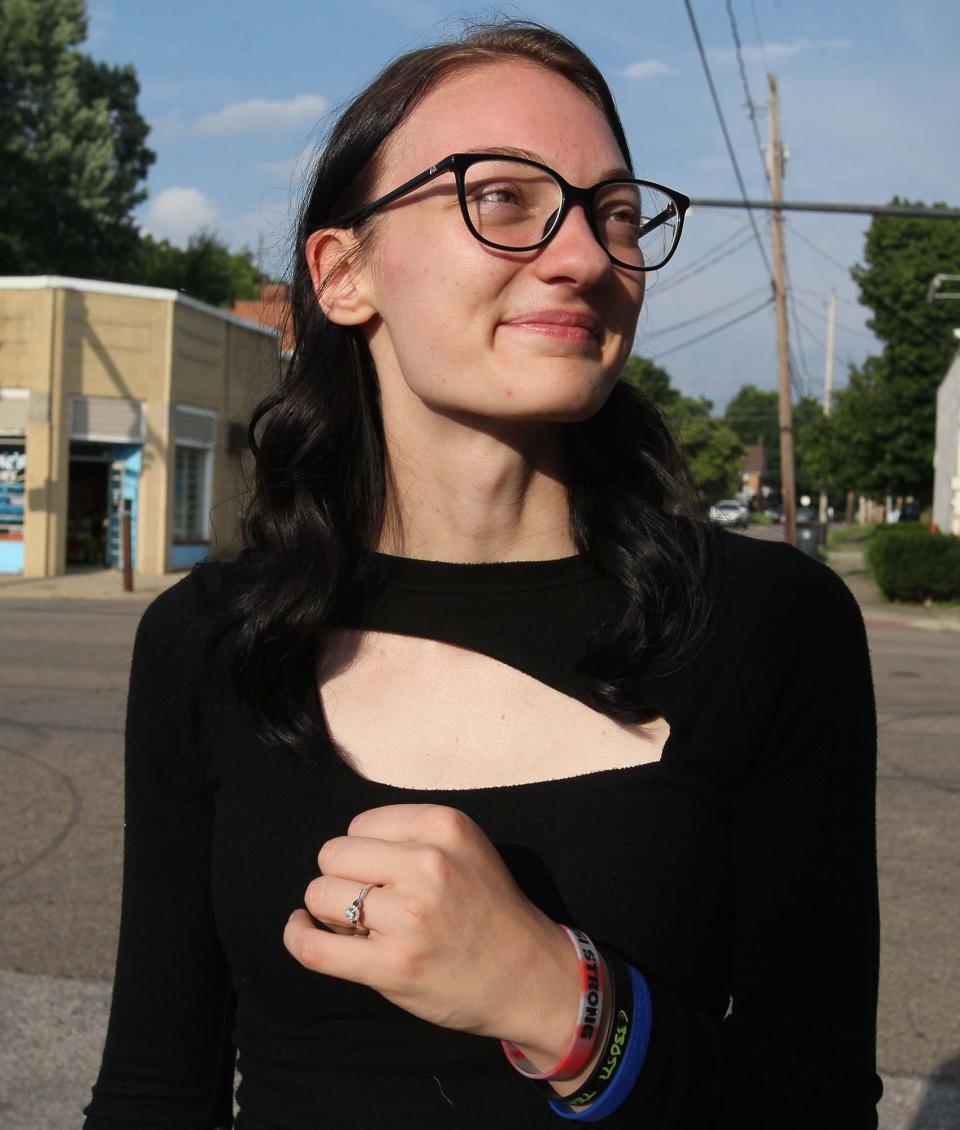 Brianna Buckingham, Matthew Parisi's fiancee, wears her "Parisi Strong" bracelets and a ring he gave her.