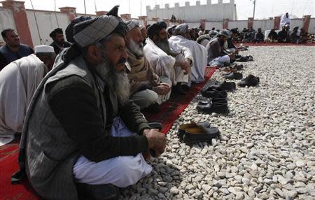 Afghan elders gather during a meeting in Maidan, Wardak province, March 11, 2013. REUTERS/ Mohammad Ishaq