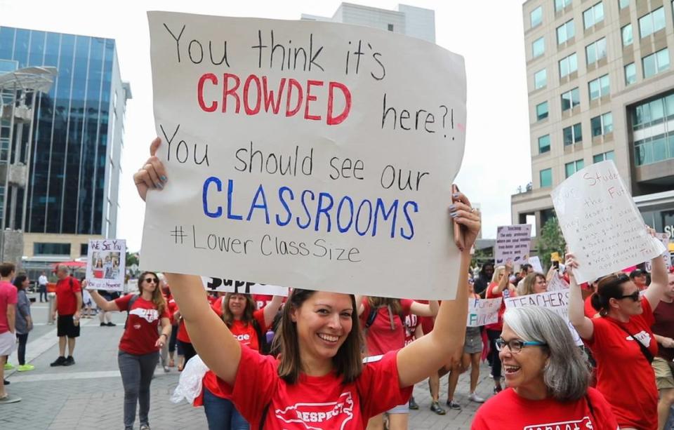 Thousands of teachers march on Fayetteville Street to the N.C. Legislative building in Raleigh, N.C. Wednesday, May 16, 2018  during the ”March for Students and Rally for Respect,” the largest act of organized teacher political action in state history.