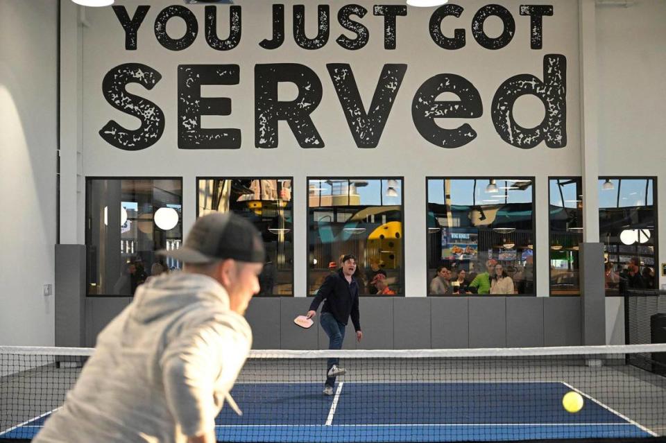 Guests played pickleball at Serv’s soft opening Thursday.