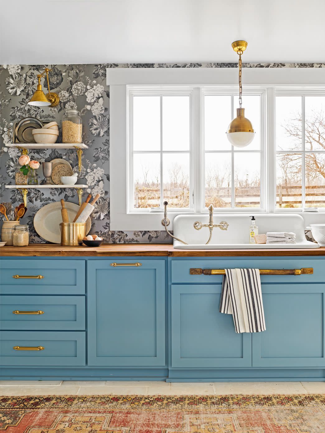 blue farmhouse kitchen with black and white wallpaper