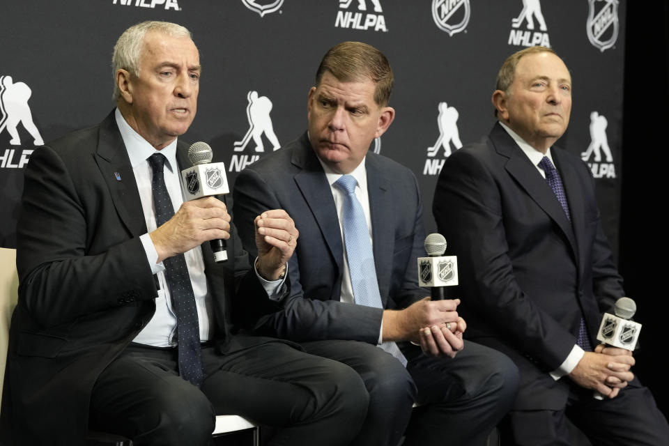 IIHF president Luc Tardif, left to right, NHLPA Executive Director Marty Walsh and NHL Commissioner Gary Bettman attend a news conference in Toronto, Friday Feb. 2, 2024. NHL players are returning to the Olympics for the first time in more than a decade. The world's top hockey league will allow its players to participate in the Games in 2026 in Milan and in 2030 under an agreement announced Friday by the NHL, the NHL Players’ Association, International Ice Hockey Federation and the IOC. (Frank Gunn/The Canadian Press via AP)