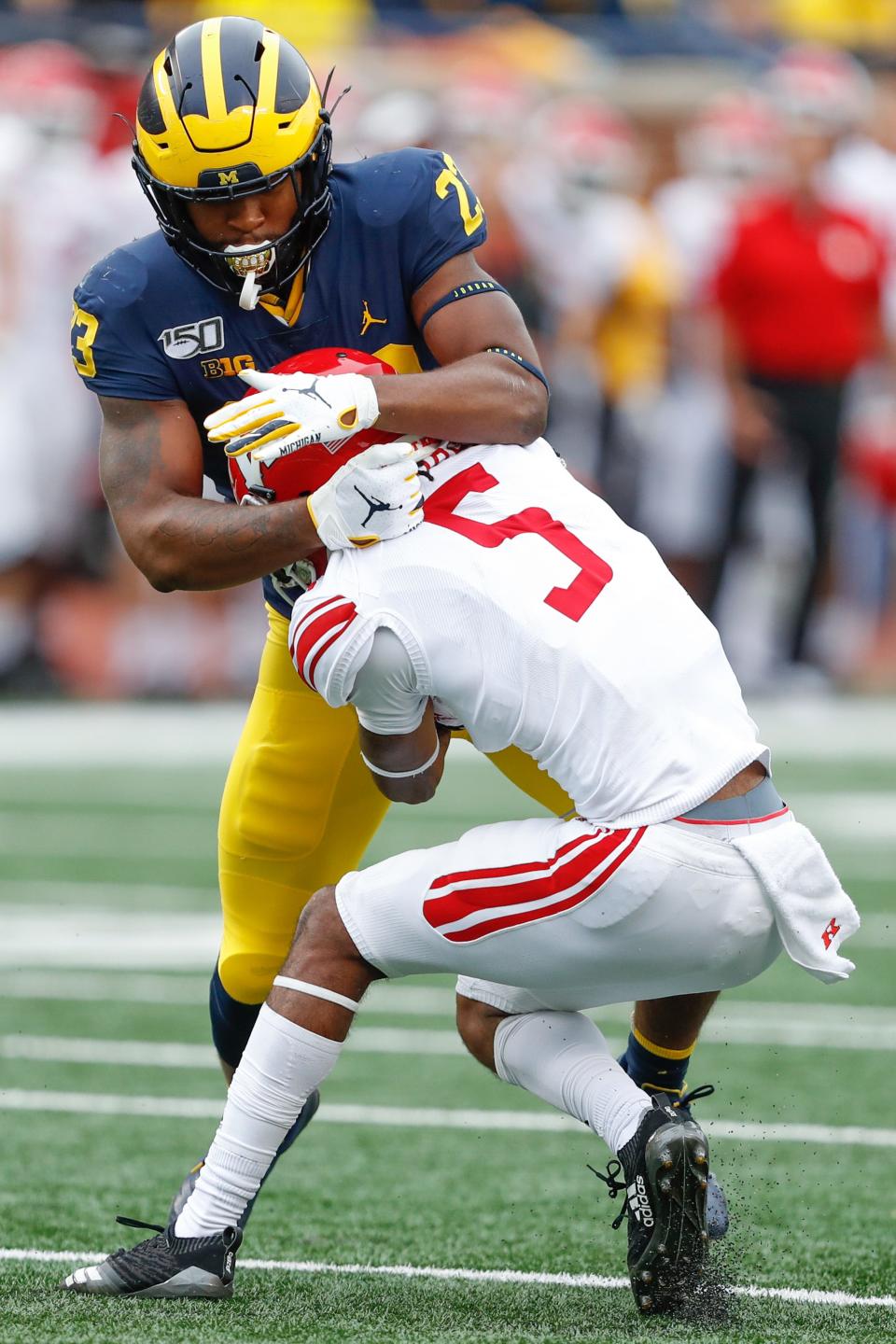 Michigan linebacker Michael Barrett wraps up Rutgers receiver Paul Woods during the fourth quarter at Michigan Stadium, Sept. 28, 2019.