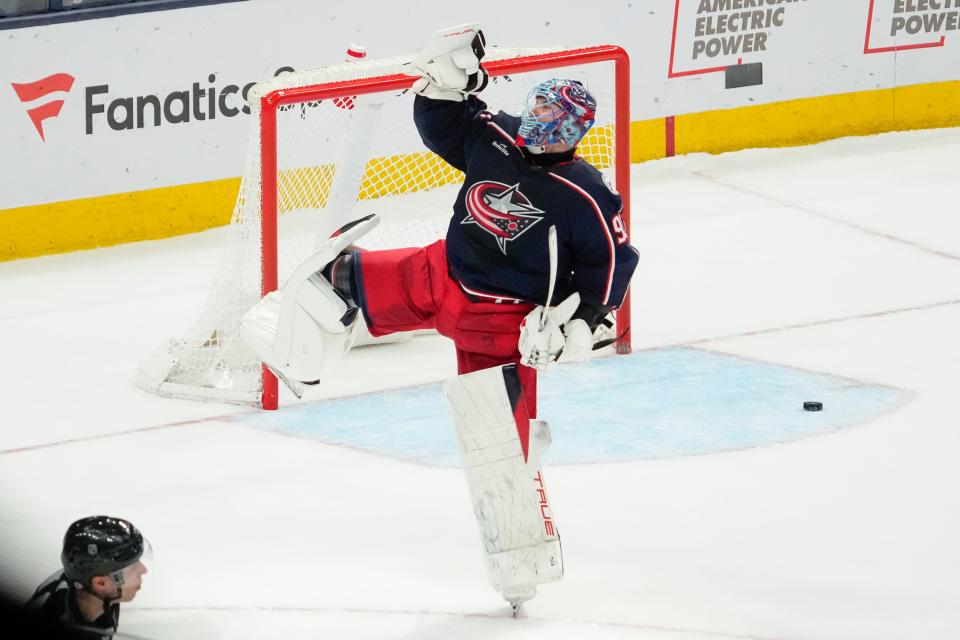 Jan 15, 2024; Columbus, Ohio, USA; Columbus Blue Jackets goaltender Elvis Merzlikins (90) celebrates following the shootout in the NHL hockey game against the Vancouver Canucks at Nationwide Arena. The Blue Jackets won 4-3.