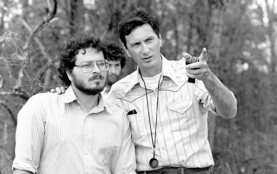 Director Lawrence Kasdan and cinematographer John Bailey, on set, of THE BIG CHILL, 1983.