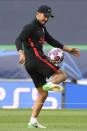 Atletico Madrid's head coach Diego Simone juggles with a ball during a training session at the Jose Alvalade stadium in Lisbon, Wednesday Aug. 12, 2020. Atletico Madrid will play Leipzig in a Champions League quarterfinals soccer match on Thursday. (Lluis Gene/Pool via AP)