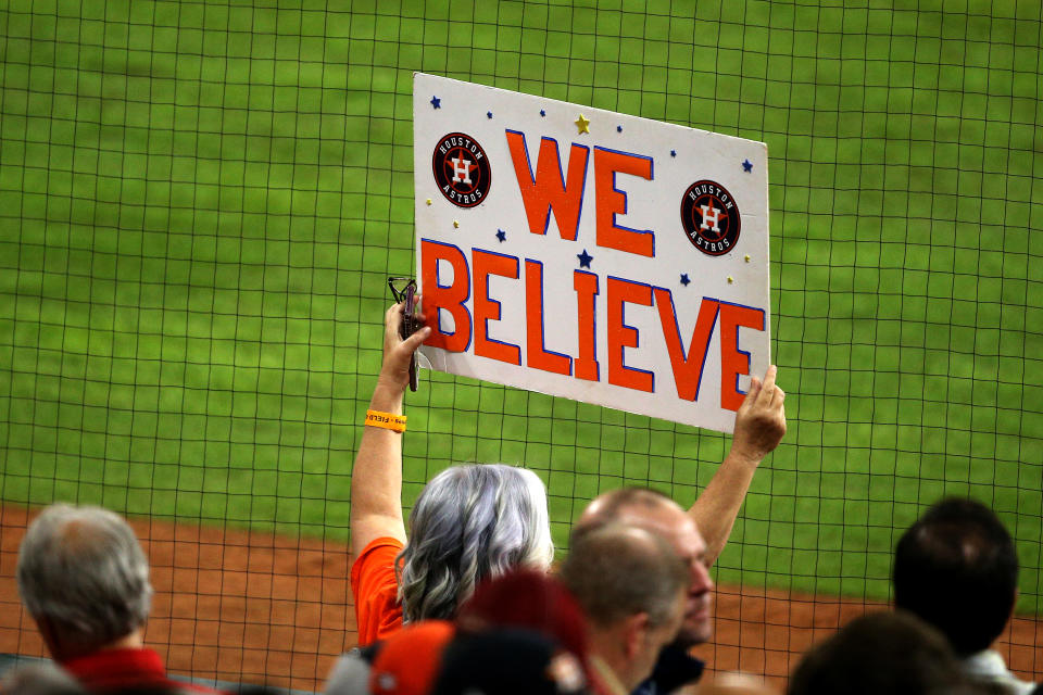 HOUSTON, TEXAS - OCTOBER 22:  A fan holds a sign during the seventh inning in Game One of the 2019 World Series between the Houston Astros and the Washington Nationals at Minute Maid Park on October 22, 2019 in Houston, Texas. (Photo by Bob Levey/Getty Images)