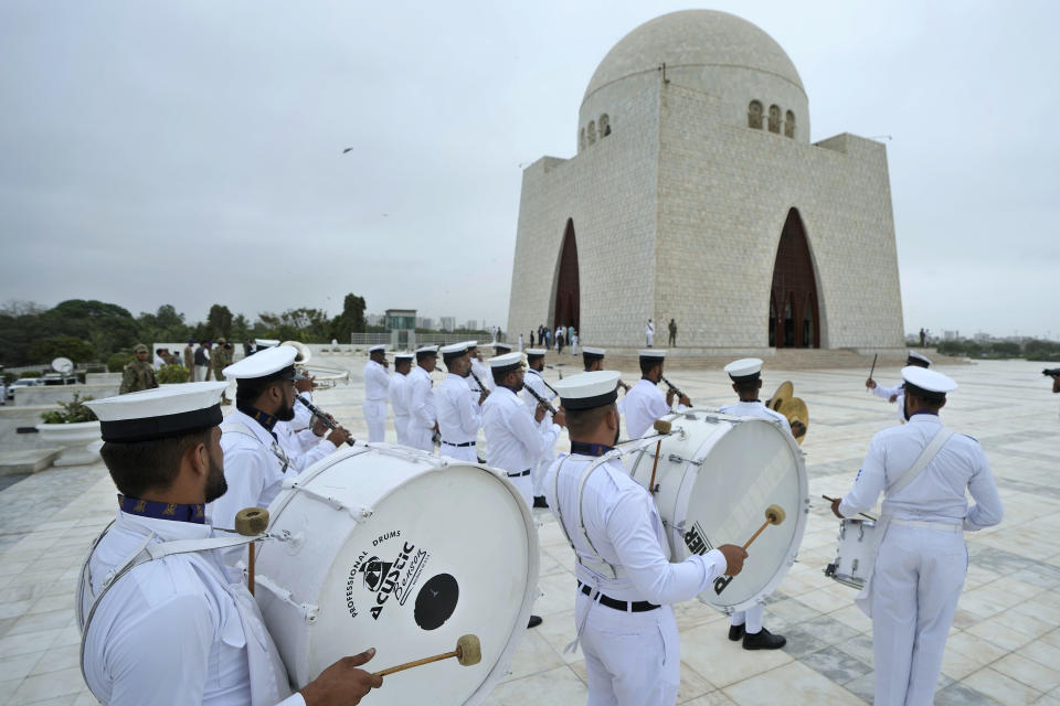 A band of Pakistan Navy performs during a ceremony to commemorate Independence Day at the mausoleum of Muhammad Ali Jinnah, founder of Pakistan, in Karachi, Pakistan, Monday, Aug. 14, 2023. Millions of Pakistanis celebrate the 76th Independence Day from British rule. (AP Photo/Fareed Khan)