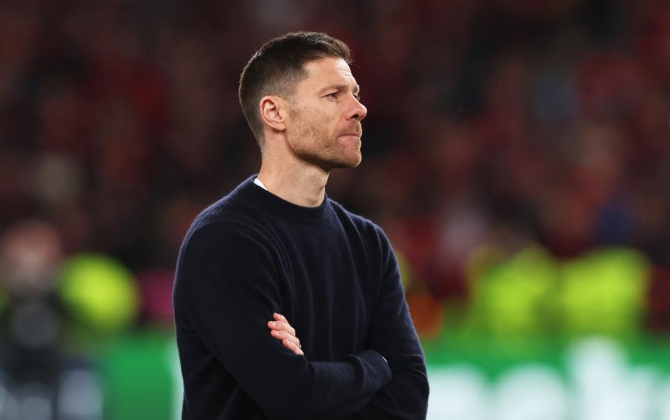 Xabi Alonso, Head Coach of Bayer 04 Leverkusen, looks on after the team's defeat