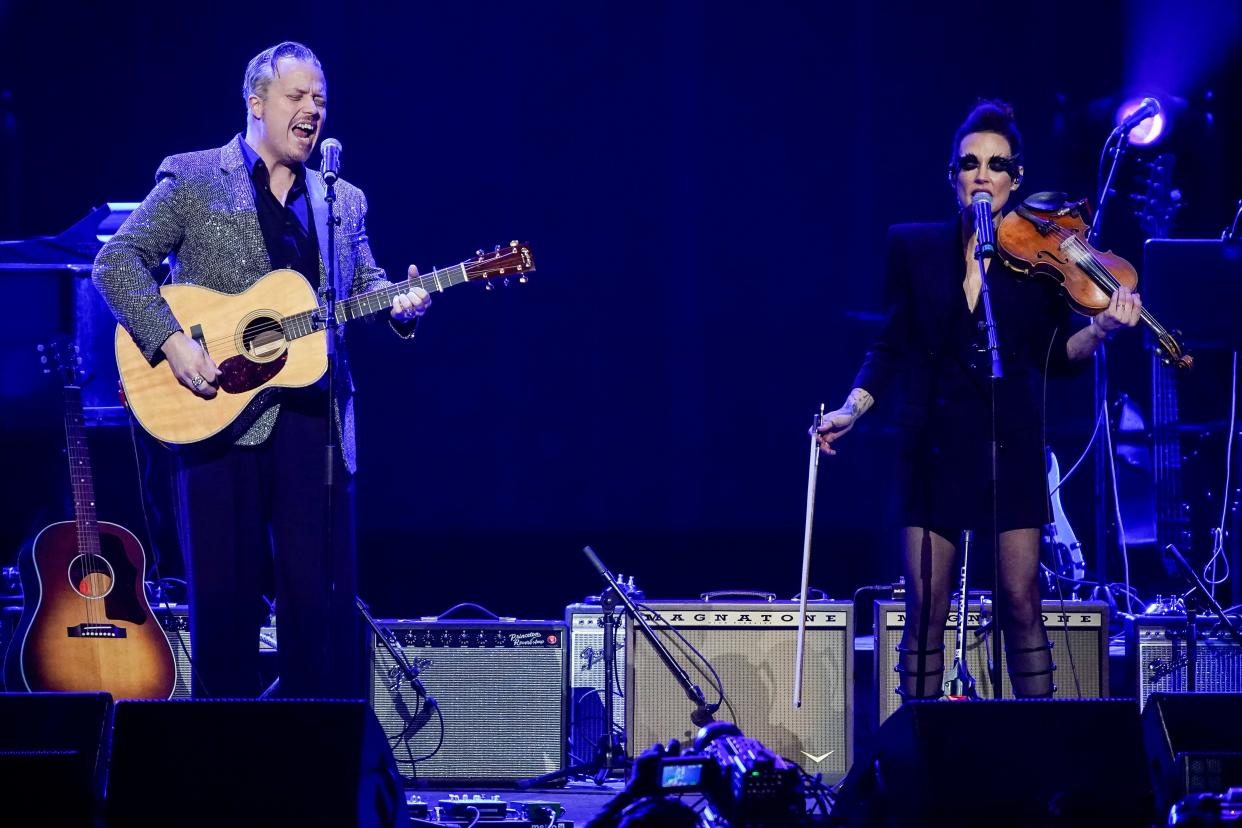 Jason Isbell and Amanda Shires perform during the Love Rising concert at Bridgestone Arena in Nashville, Tenn., Monday, March 20, 2023.