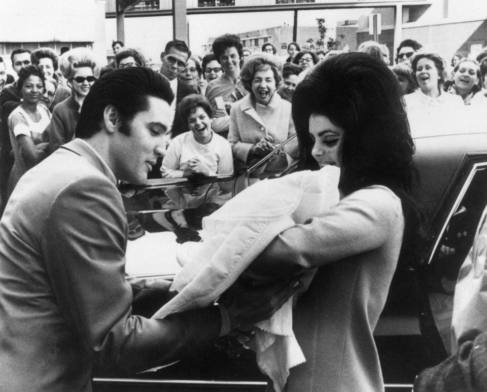 The couple show off their daughter, Lisa Marie, born on February 2 1968 (Keystone/Getty Images)