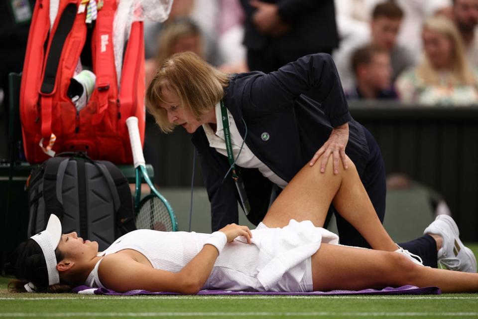 Raducanu receives treatment at the start of the third set (AFP via Getty Images)