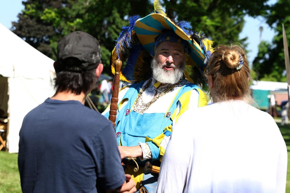 Renaissance-period reenactor Roger Bechtel answers questions at the 4th Annual Old Timey Days event, at Williams Park on May 18 and 19, in Gibsonburg