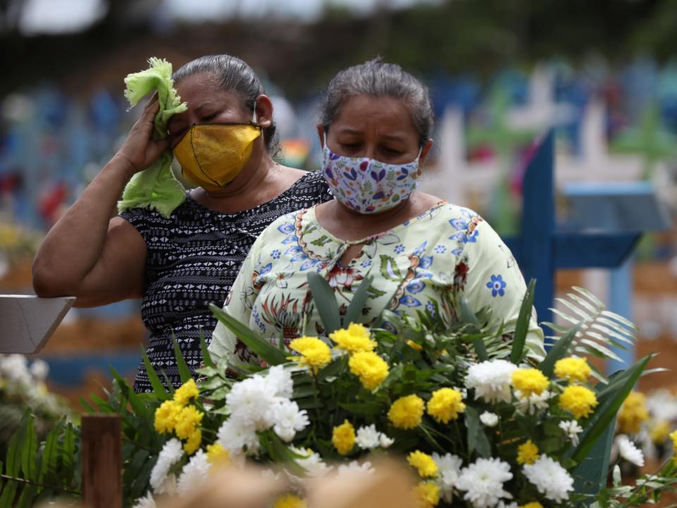 Women react during a collective burial of people that have passed away due to the coronavirus disease (COVID 19), at the Parque Taruma cemetery in Manaus, Brazil April 28, 2020. .JPG